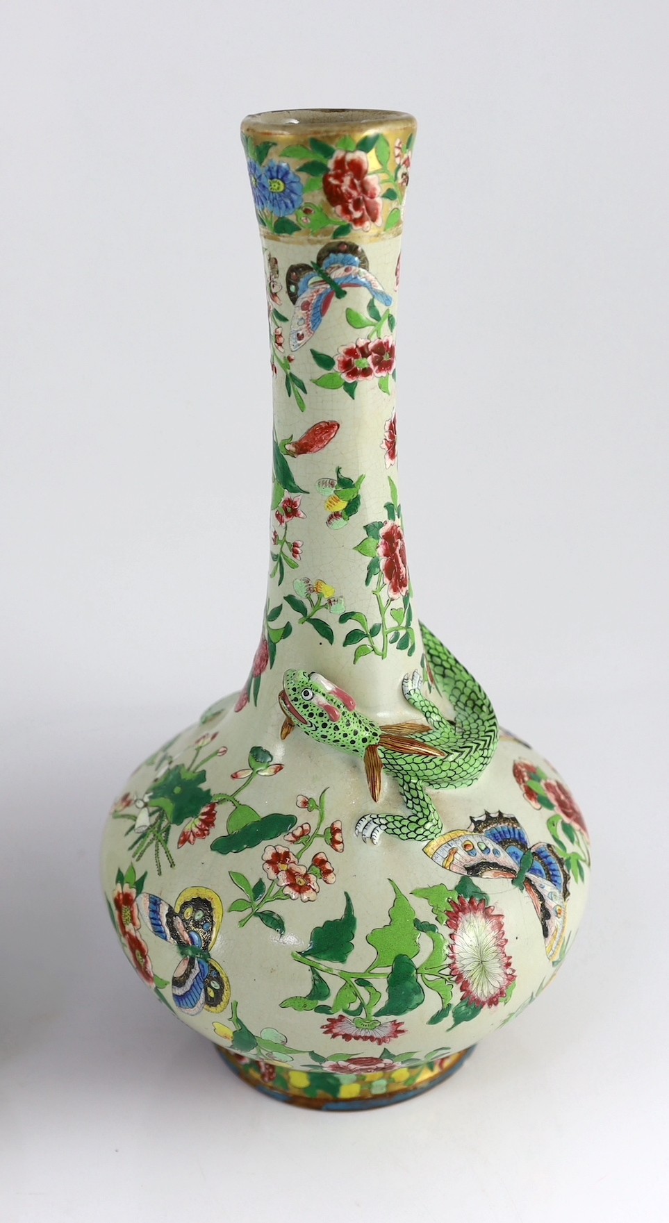 A pair of Chinese enamelled porcelain crackle glaze bottle vases, mid 19th century, 33cm high, chips to feet